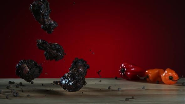 Smoked chicken wings falling and bouncing in ultra slow motion 1500fps - CHICKEN WINGS PHANTOM alt