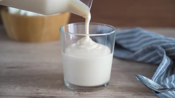 Homemade fermented baked milk. Traditional healthy drink ryazhenka or homemade yogurt alt