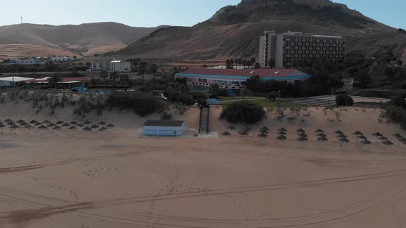 Buildings at Porto Santo beach, Portugal. Aerial backward ascending alt
