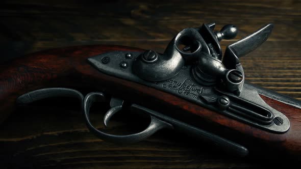 Flintlock Pistol On Wooden Table alt
