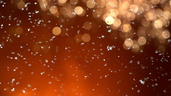 Super Slow Motion Shot of Real Snow Falling on Golden Background at 1000 Fps alt