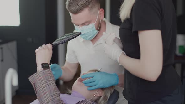 In the dental clinic the patient is served by two dentists