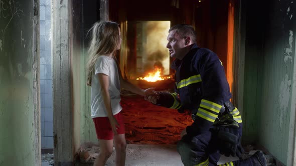 Fireman Interrogating Girl in Burning Hallway alt