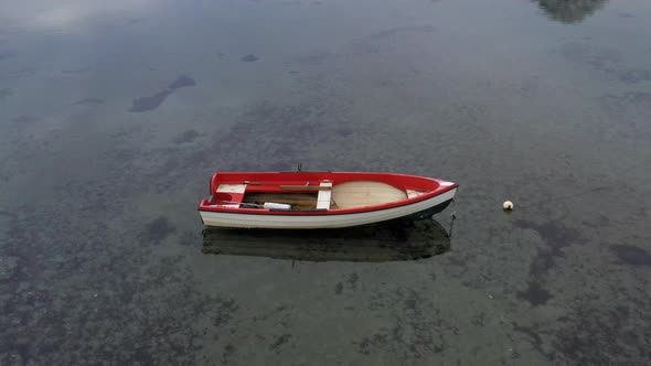 Rowboat with Red and White Color Floating alt