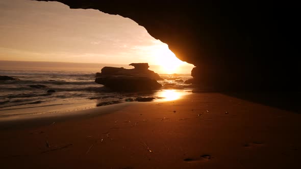 Sunrise in a Beach Cave alt