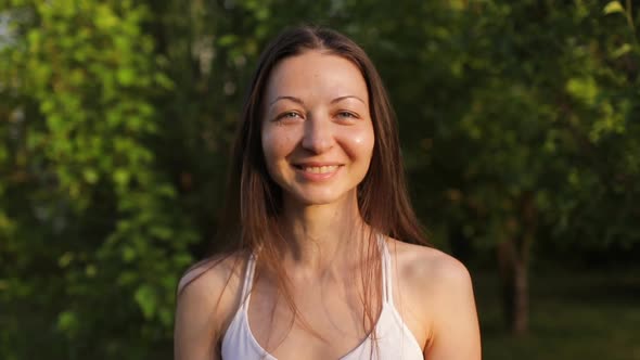 Portrait of a Woman on Nature Posing in Front of the Camera