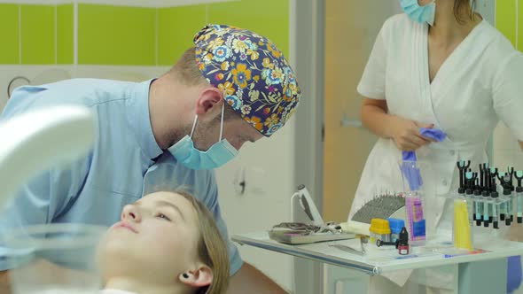 Male dentist and patient alt