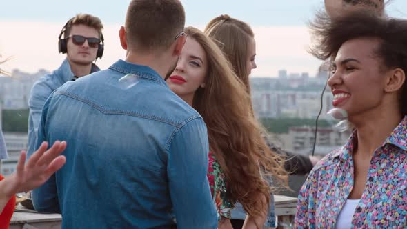 Adorable Young Couple at Day Rooftop Party alt