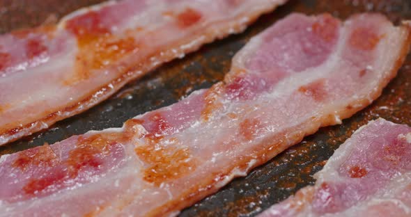 Cook with bacon on fry pan  alt