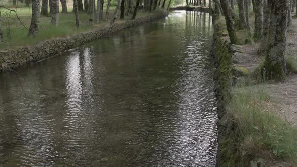Calm waters of Zezere river, Covao da Ametade in Serra da Estrela, Portugal. Tilt-up alt