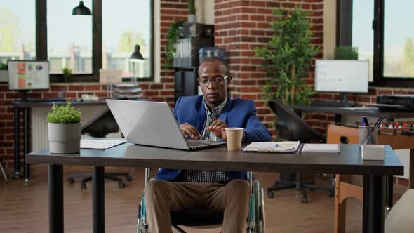 Entrepreneur with Impairment Working in Disability Friendly Office alt