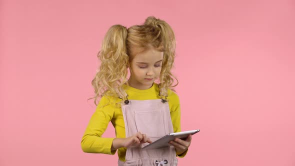 Pretty Young Female Is Making Selfie on the Tablet alt