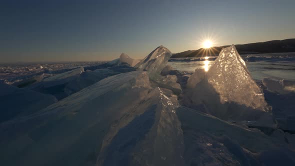 Sunset with Sunlight Trough Transparent Piece of Ice Floe