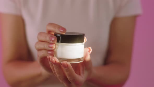 Concept of Cosmetics Skincare Treatment on Pink alt