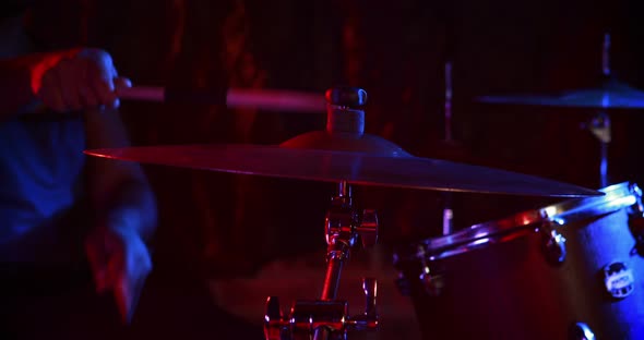 Drummer playing on drum set 4k alt