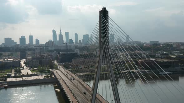 Aerial view of Świętokrzyski Bridge and Warsaw city skyline in the background. Warsaw, Poland. alt