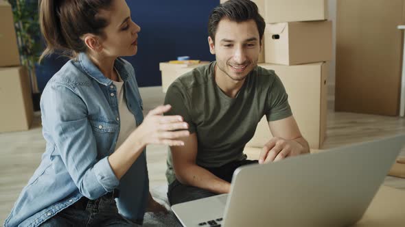 Video of couple doing shopping online for a new house. Shot with RED helium camera in 8K alt