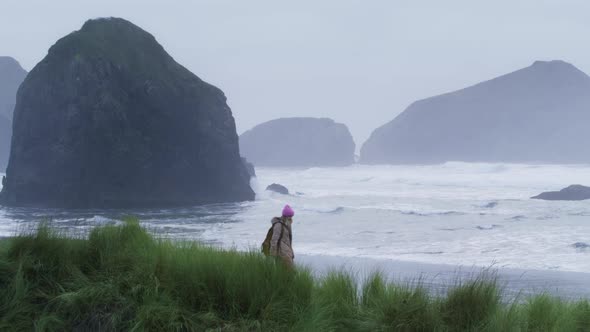 Woman Traveler of Cloudy Rainy Day at Rocky Beach 6K Cinematic Ocean Coast USA alt