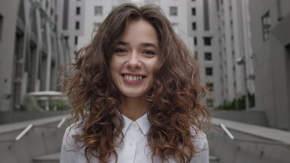 Face Of Young Girl On City Street alt