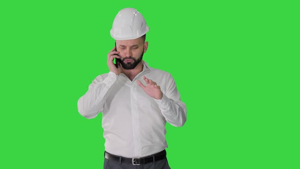 Architect Talking By the Phone While Walking on a Green Screen Chroma Key alt