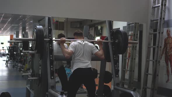 An Athlete Prepares for Barbell Exercise. Slow Motion alt