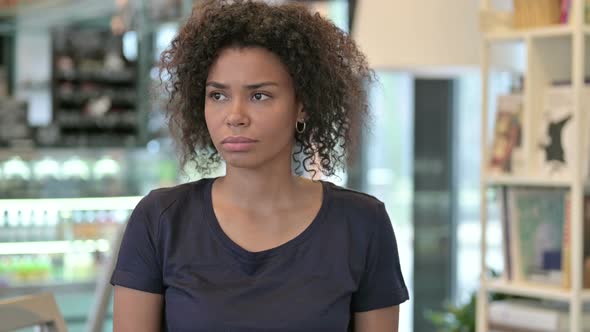 Portrait of Anxious Young African Woman Waiting, Watching Time  alt