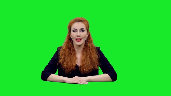 Attractive Female Anchor Presenting Live News Against Green Screen