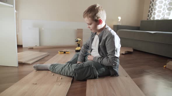 Child Sits on Furniture Panels alt