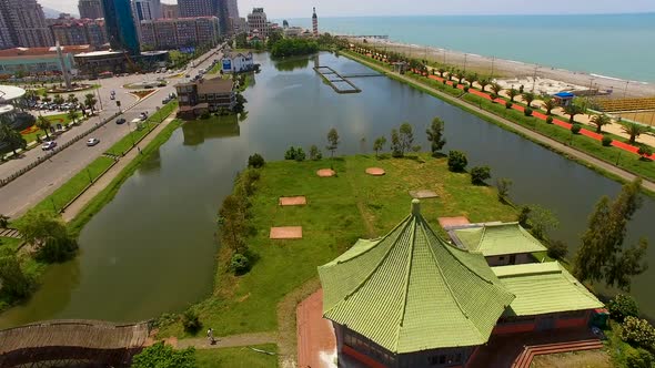 Ardagani Lake near seafront Batumi Georgia with small island in it, cityscape alt