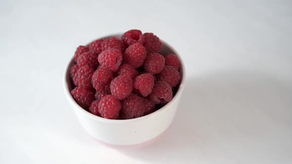 Delicious Raspberries in a White Plate