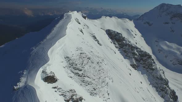 Aerial Closeup Snow Covered Mountain alt
