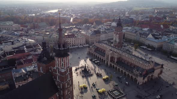 Aerial circling Main Market Square at golden hour, Krakow alt
