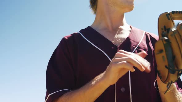 Baseball players holding ball during practice session alt