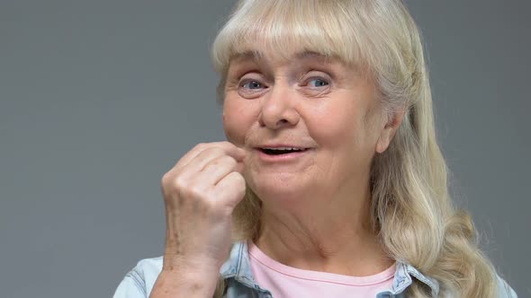 Happy Grandmother Taking White Pill With Water, Health Care, Vitamin Supplement alt