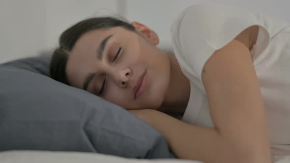 Hispanic Woman Sleeping in Bed Peacefully, Side Pose alt