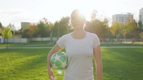 Portrait of Woman Football Player in the Park