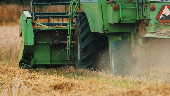 Back View Of A Tractor In An Agricultural Field alt