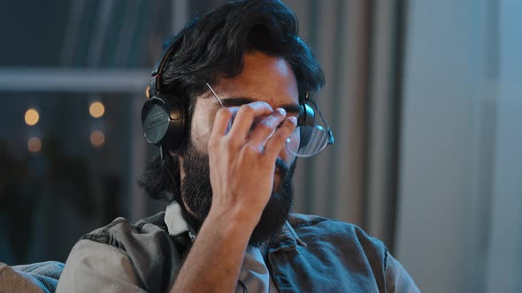 Portrait Arab Multiracial Man Millennial Guy 30s Male with Beard Brunette in Headphones Sitting at alt