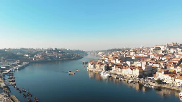 4k aerial drone footage of the river channel of coastal city of Porto in northwest Portugal alt