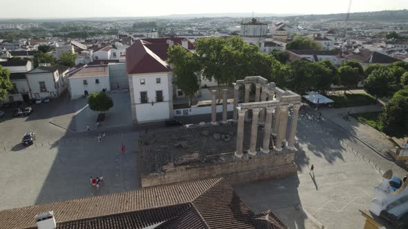 Aerial circle view over square with an old roman temple in the middle. Evora, Portugal