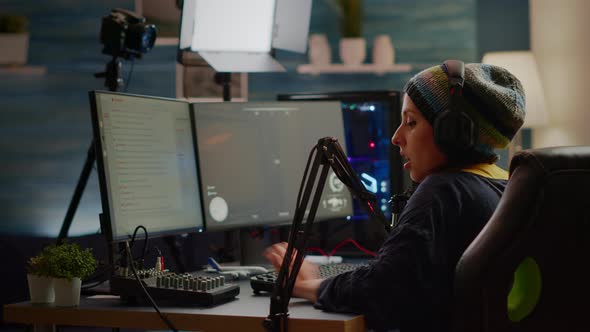 Focused Streamer Playing Shooter Game for Virtual Competition alt