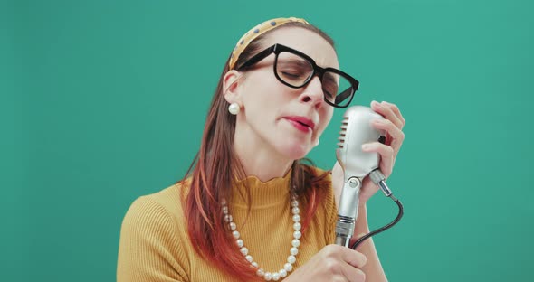 Vintage style woman singing with a microphone