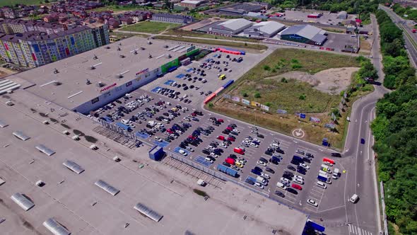 Drone Flies Over a Large Used Car Parking Lot alt