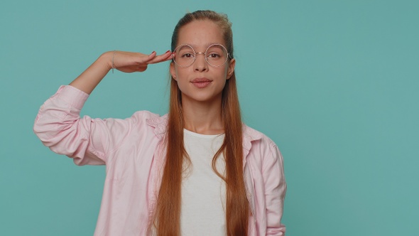 Serious Teenager Girl Giving Salute Listening to Order As If Soldier Following Discipline Obeying alt