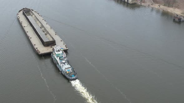 The Barge Floats on the River