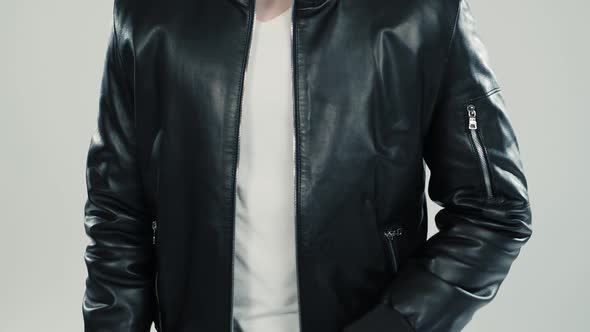 Close-up of Leather Jacket Details on Dancing Man and Woman alt