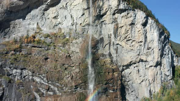 Aerial View of a Waterfall and Rainbow in the Village of Lauterbrunnen. Switzerland in the Fall