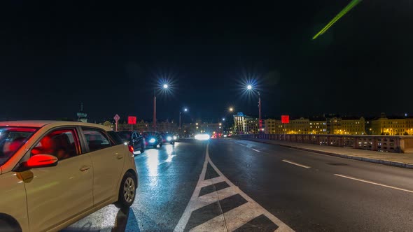 Traffic on the Jiraskuv Bridge Over the Still Waters of the River Vltava in the Centre of Prague alt