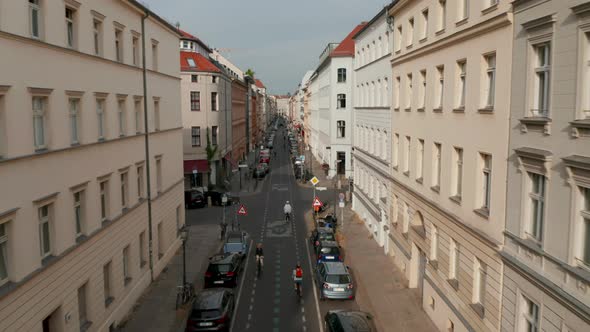 Forwards Tracking Shot of Cyclists Riding on Bike Highway in Linienstrasse Street Where Cyclists alt