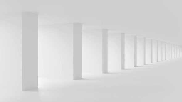 Shadow and light in a large, white, corridor.
